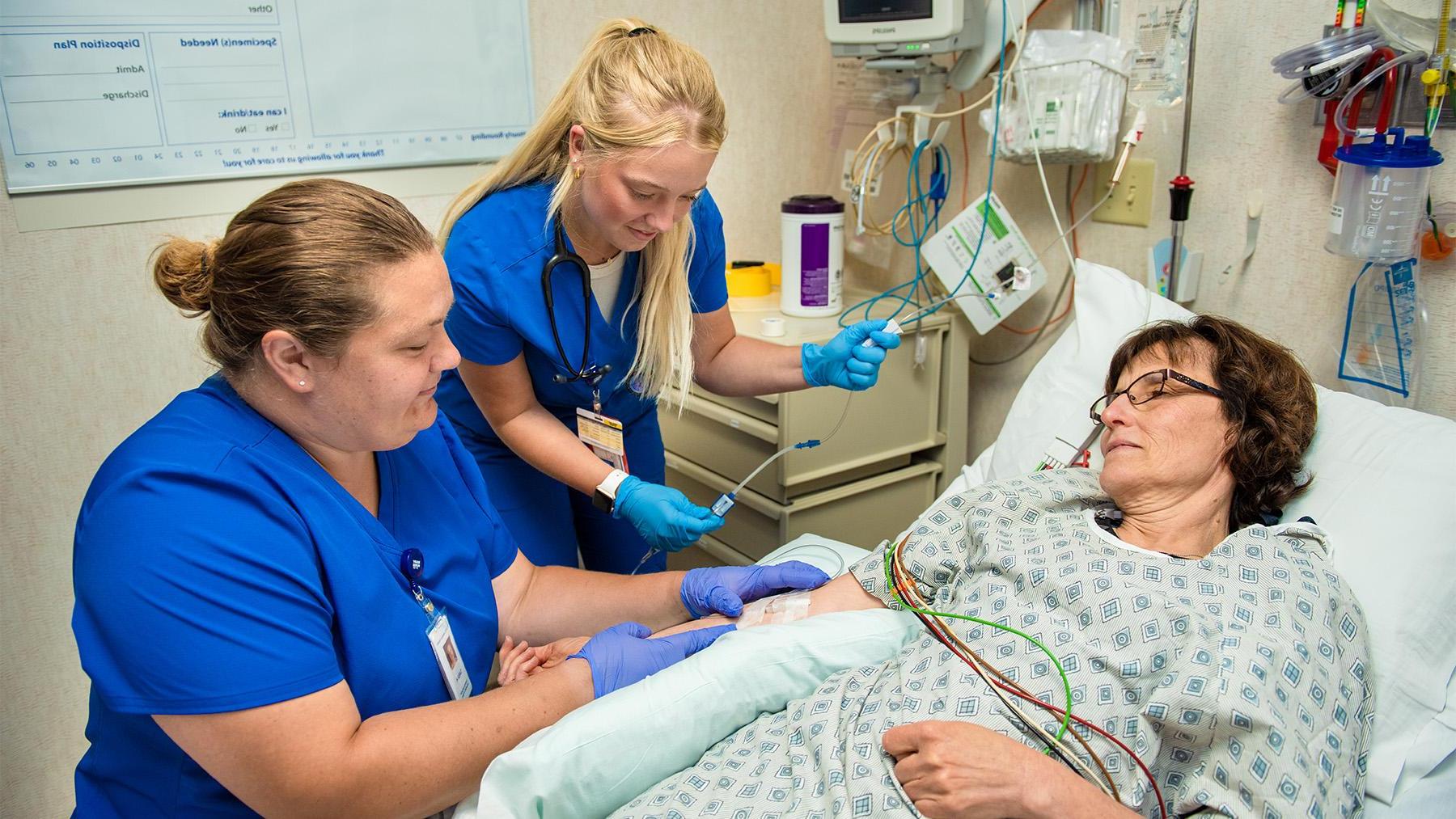 students working with a patient in Saint Alexis Hospital